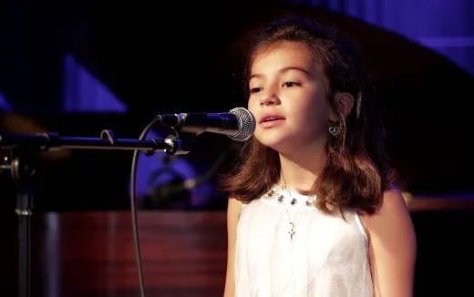 a person standing in front of a microphone