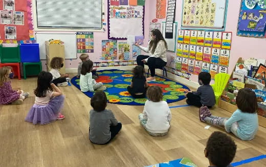 a person teaching a group of children