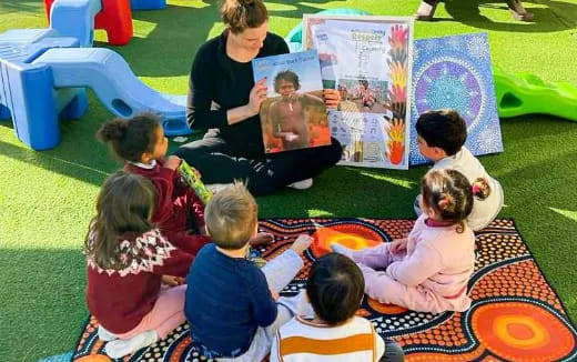 a person teaching children