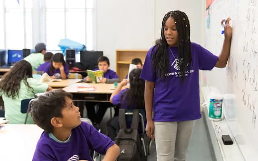 a teacher teaching a student