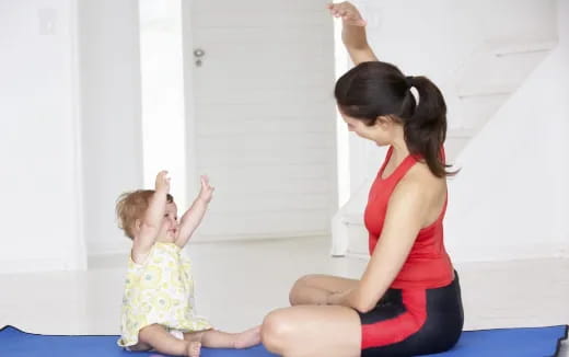 a woman and a child exercising