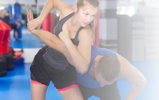 a woman lifting another woman