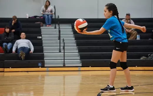 a woman playing volleyball