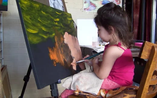 a young girl painting