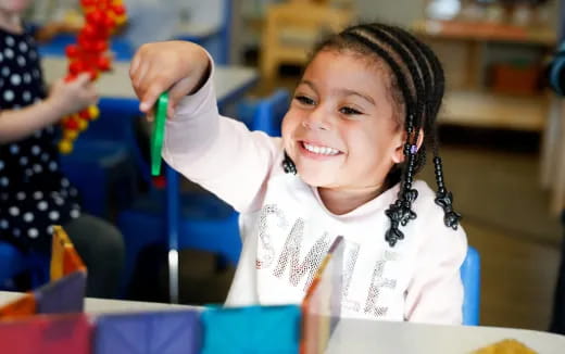a young girl smiling