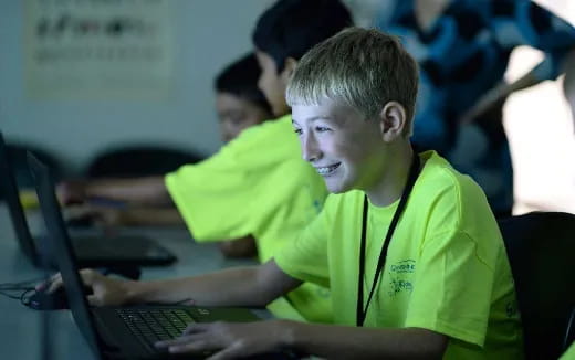 a young man using a laptop