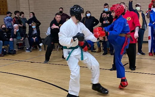 two people in a fighting ring
