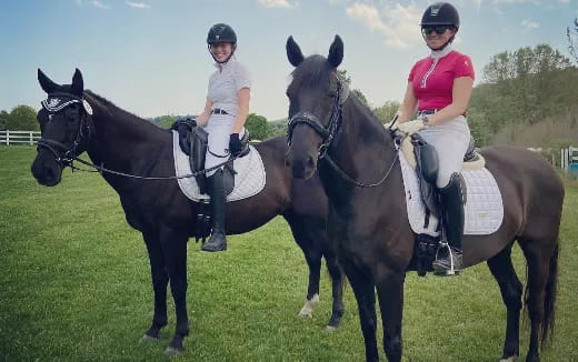 two women riding horses