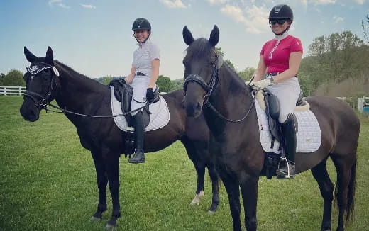 two women riding horses