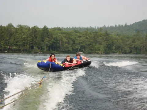 a group of people on a raft