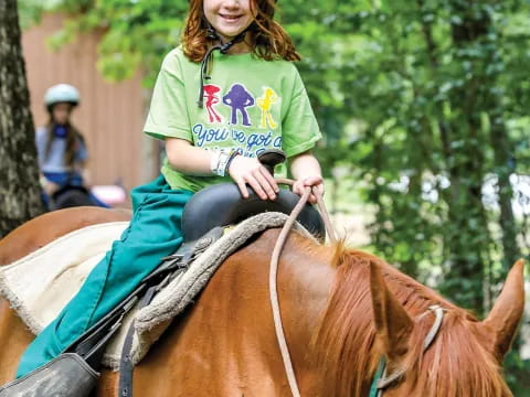 a girl riding a horse