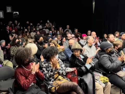 a group of people sitting in chairs