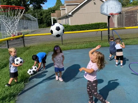 kids playing with football balls