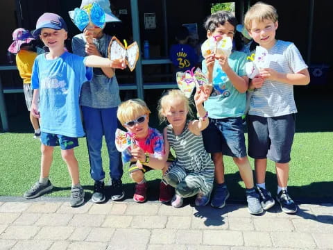 a group of kids posing for a photo