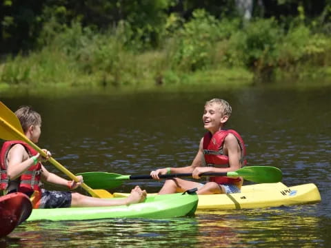 two boys in kayaks