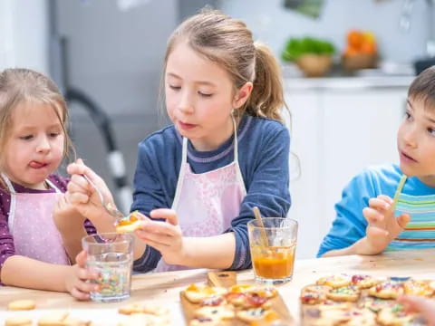 a group of children eating pizza