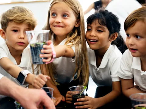 a group of children holding glasses