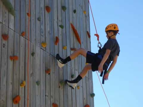 a person climbing a rock wall