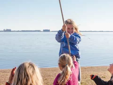 a girl holding a stick