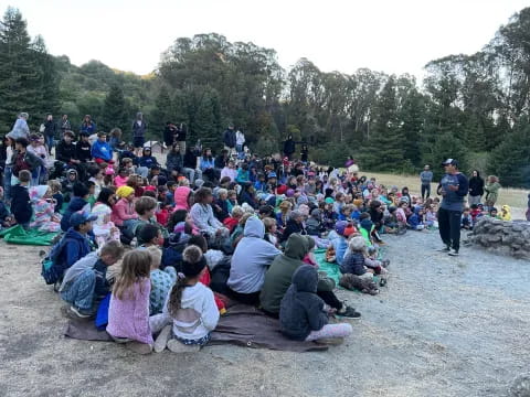 a group of people sitting on the ground