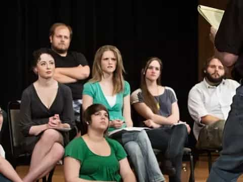 a group of people sitting on the floor