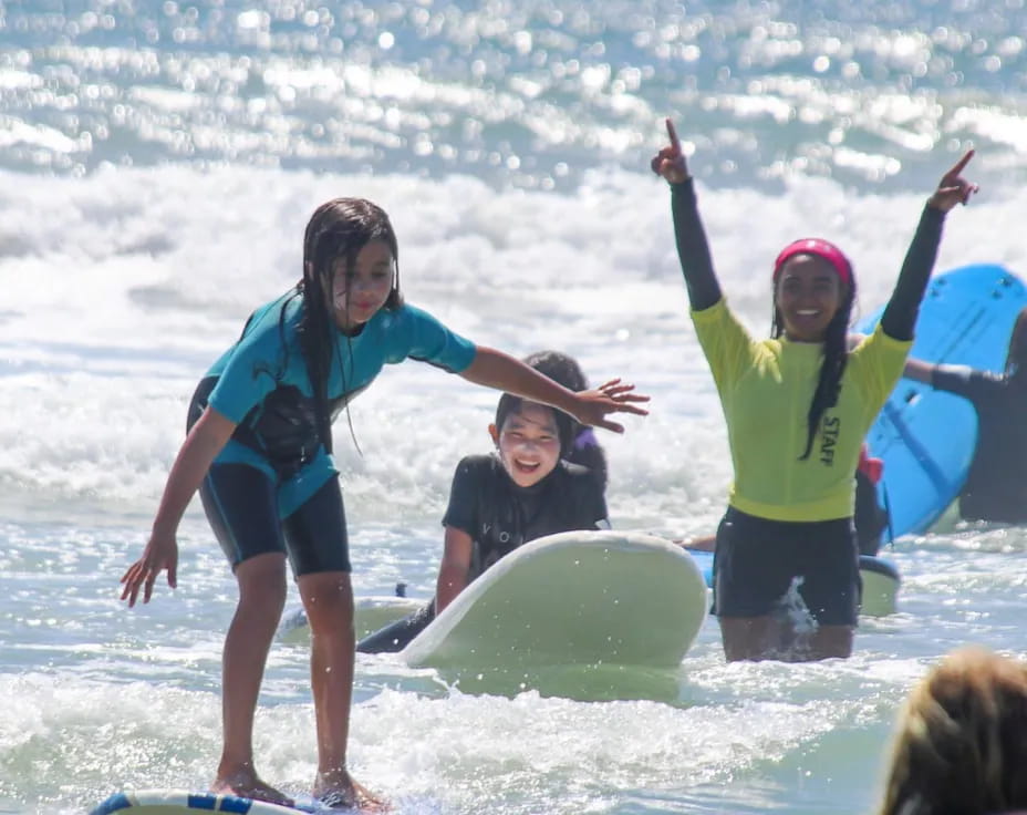 a group of people on surfboards