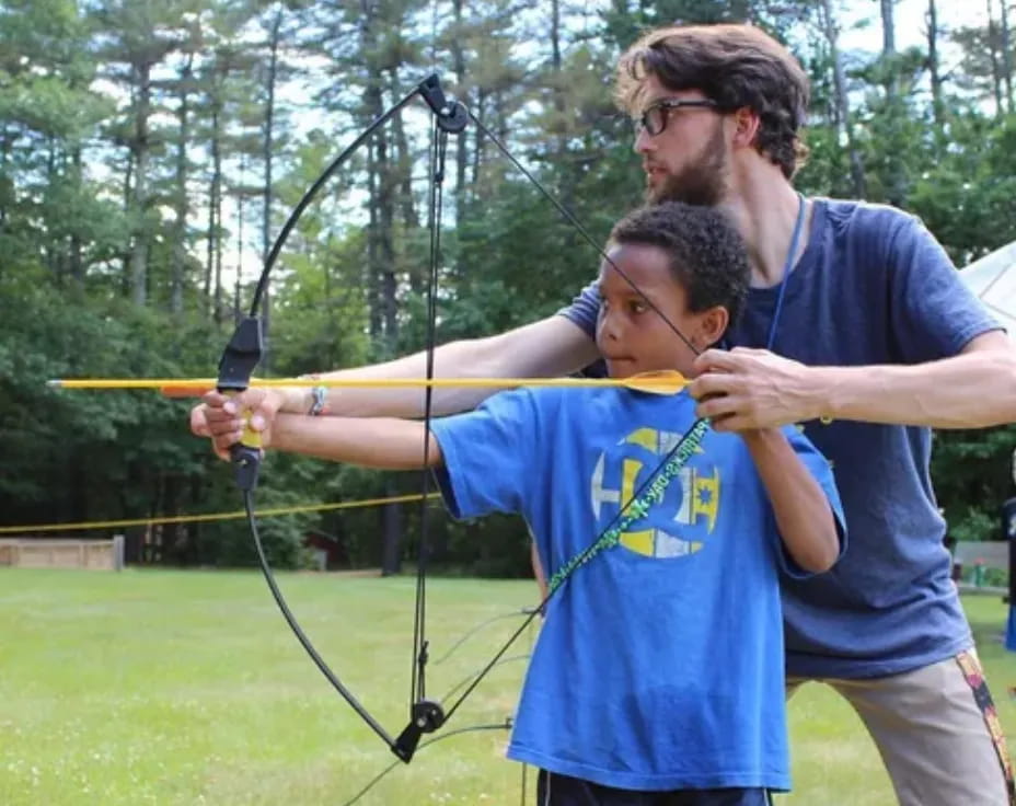 a man holding a bow and arrow