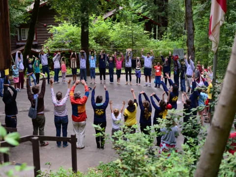 a group of people standing on a bridge over a river