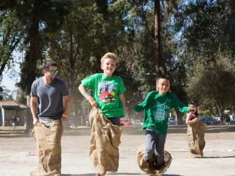 a group of people playing on a dirt path