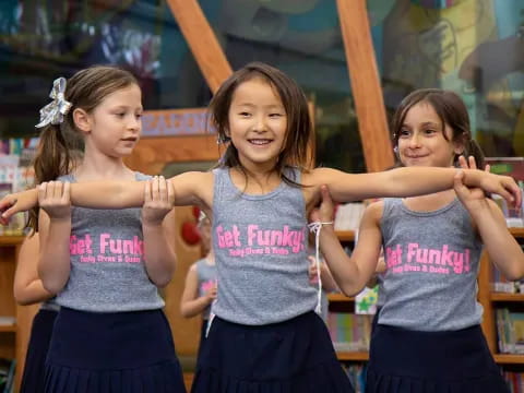 a group of girls wearing matching t-shirts