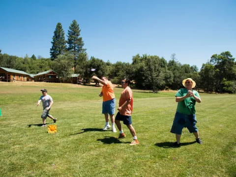 a group of people playing frisbee