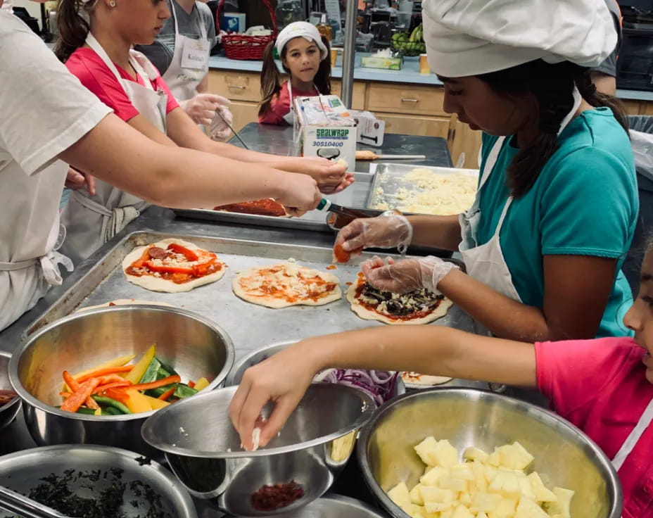 a group of people preparing food