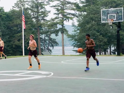 a group of men playing basketball