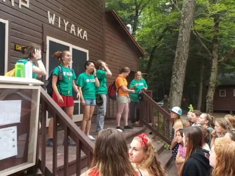 a group of people standing on a porch