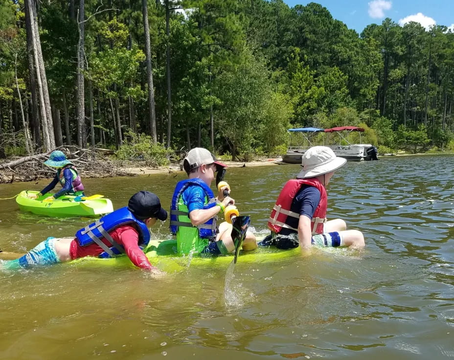 a group of people in a river