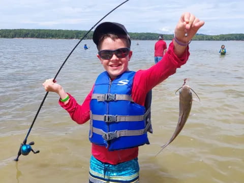 a person holding a fish