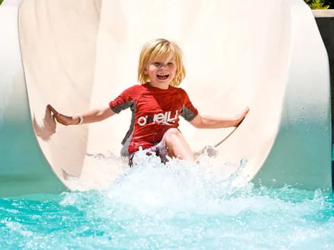 a child in a water slide