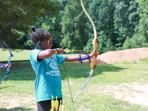 a person holding a bow and arrow