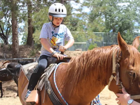 a girl riding a horse