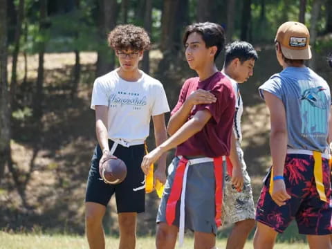 a group of boys playing football