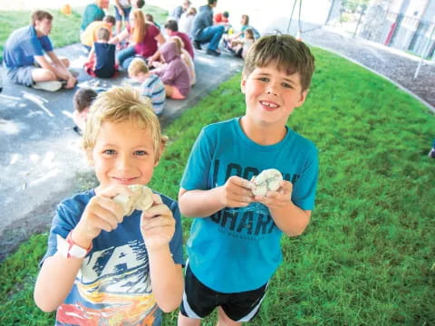 a couple of kids eating ice cream