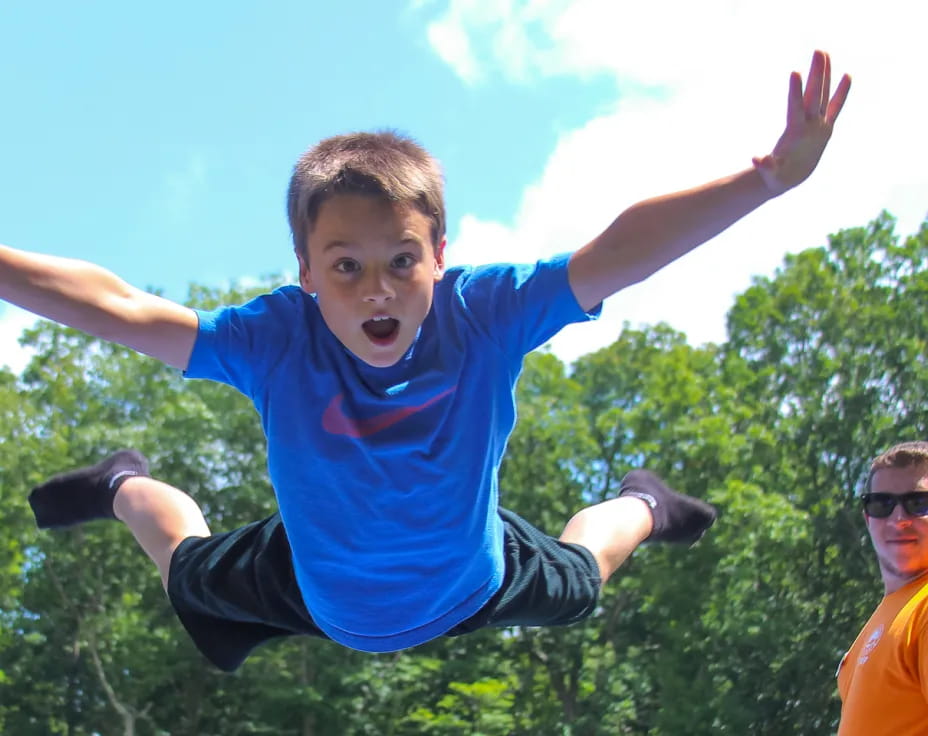 a boy jumping in the air