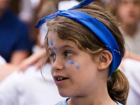 a woman with blue paint on her face