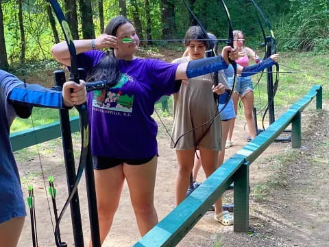 a group of people on a swing set