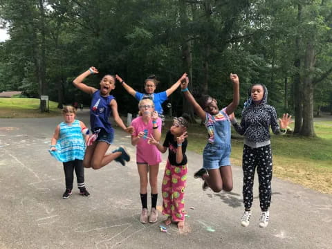 a group of people jumping in the air