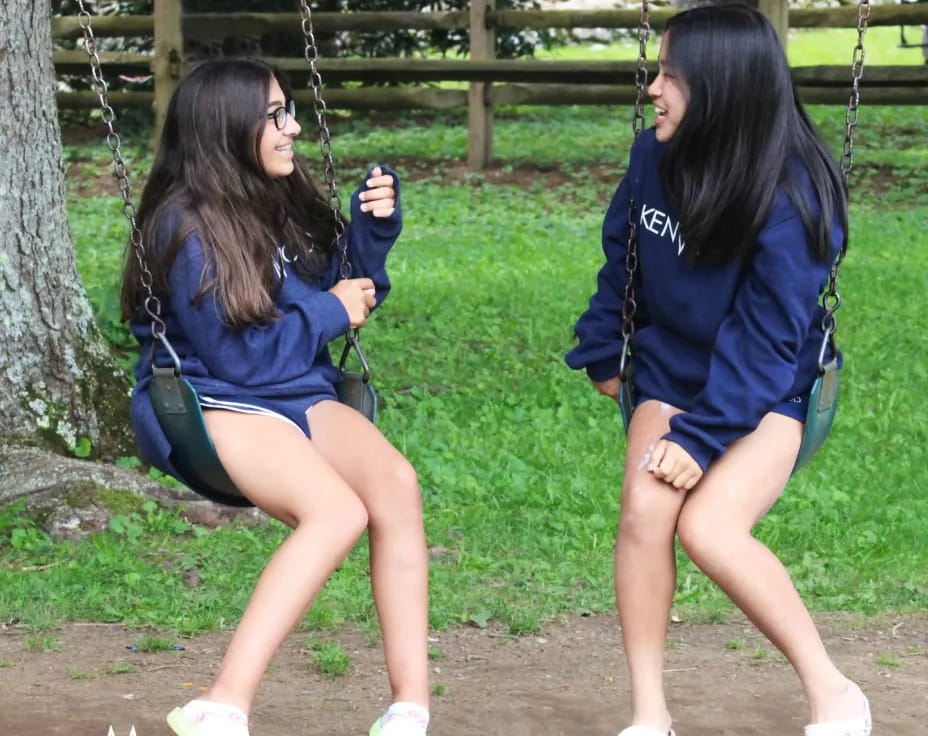 two women in blue shirts