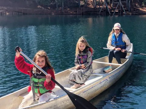 a group of people in a canoe