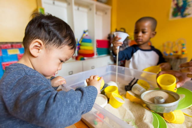 a few young boys playing with toys