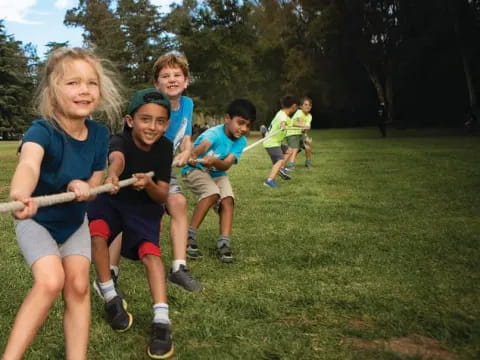 a group of kids running on a trail