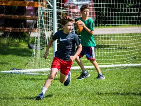 a couple of boys playing football